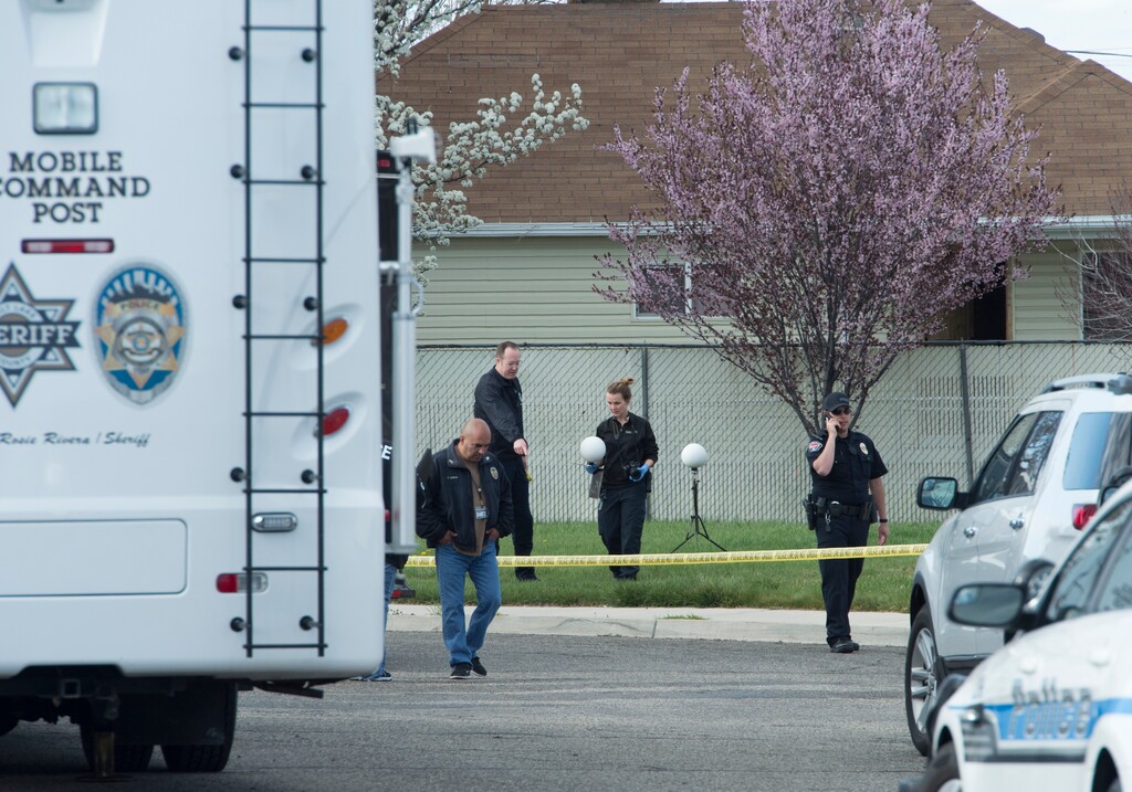 (Rick Egan  |  The Salt Lake Tribune)     Investigators from West Valley and Unified Police investigate an officer involved  shooting, leaving the suspect dead, in West Valley City, Sunday, April 8, 2018.