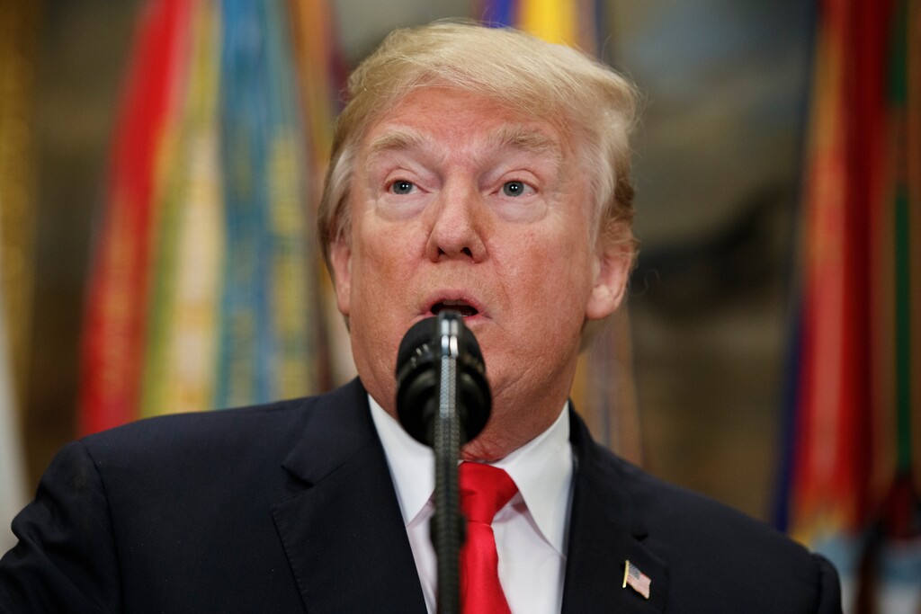 In this Dec. 12, 2017, photo, President Donald Trump speaks before signing the National Defense Authorization Act for Fiscal Year 2018, in the Roosevelt Room of the White House in Washington. An FBI agent removed from special counsel Robert Mueller’s investigative team over politically charged text messages at one point referred to Trump, then the Republican presidential candidate, as an “idiot.” The Associated Press reviewed dozens of text messages between Peter Strzok, an FBI counterintelligence agent, and Lisa Page, an FBI lawyer who was detailed to Mueller’s team earlier this year. The Justice Department turned the messages over to Congress on Dec. 12. (AP Photo/Evan Vucci)