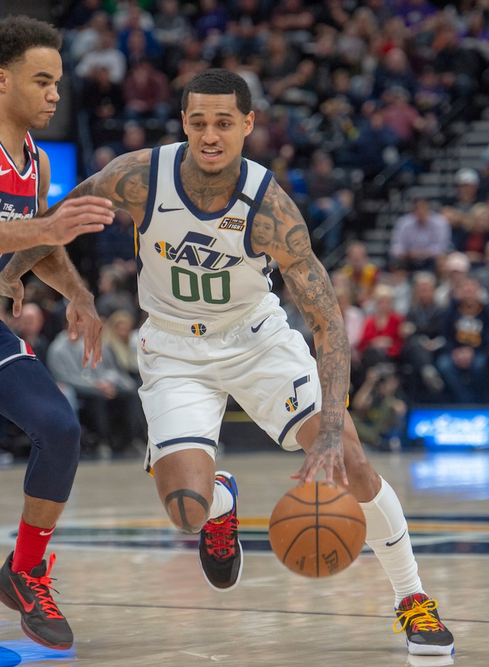 (Rick Egan  |  The Salt Lake Tribune)  Utah Jazz guard Jordan Clarkson (00) gets past Washington Wizards guard Jerome Robinson (12), in NBA action between the Utah Jazz and the Washington Wizards, in Salt Lake City, Friday, February 28, 2020