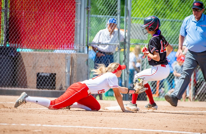 (Isaac Hale | Special to The Tribune) Spanish Fork center fielder Trinity Benson (16) successfully steals a base from Mountain Ridge third baseman Mychaela McClanahan (19) during the second game of a best-of-three series between the Spanish Fork Lady Dons and the Mountain Ridge Sentinels as part of the 5A state softball championship held at the Spanish Fork Sports Park on Friday, May 28, 2021.