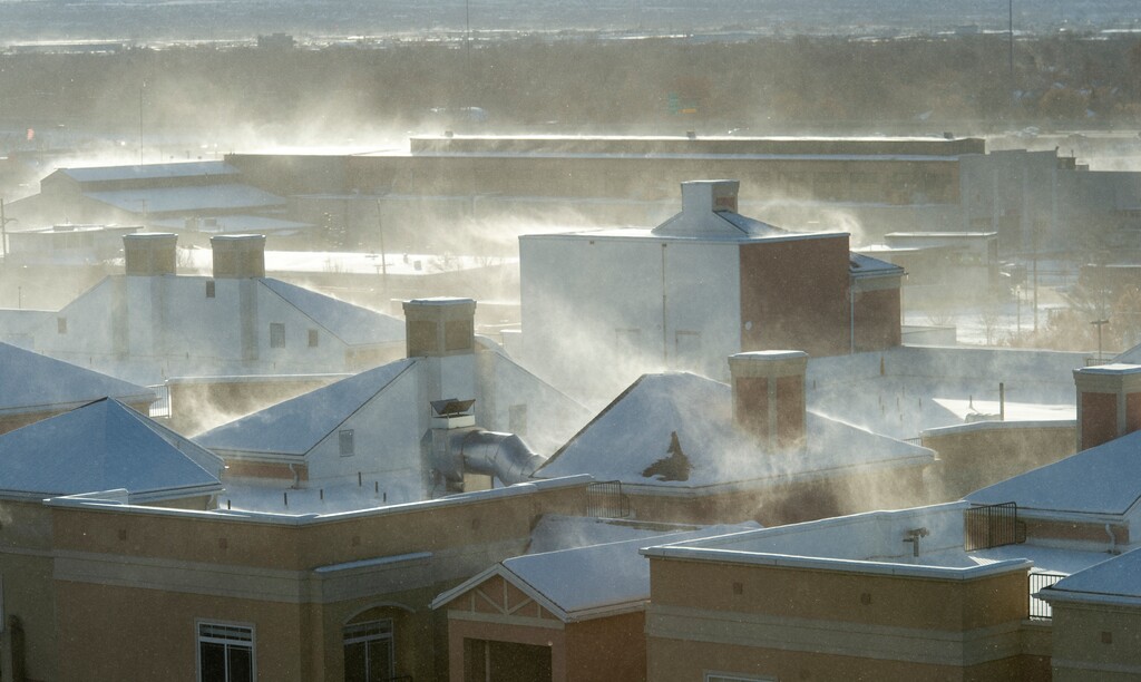 (Rick Egan  |  The Salt Lake Tribune)   High winds blow snow off of the rooftops in downtown Salt Lake City, Monday, Dec. 31, 2018.
