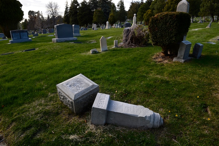 (Scott Sommerdorf | The Salt Lake Tribune)
A fallen marker at the Salt Lake City Cemetery, Friday, April 13, 2018. The cemetery is historic, beloved by relatives, neighbors, nature and recreation lovers -- and needs about $27 million in repairs, improvements and financial aid. The city is reviewing a master plan to make fixes and improvements. 

