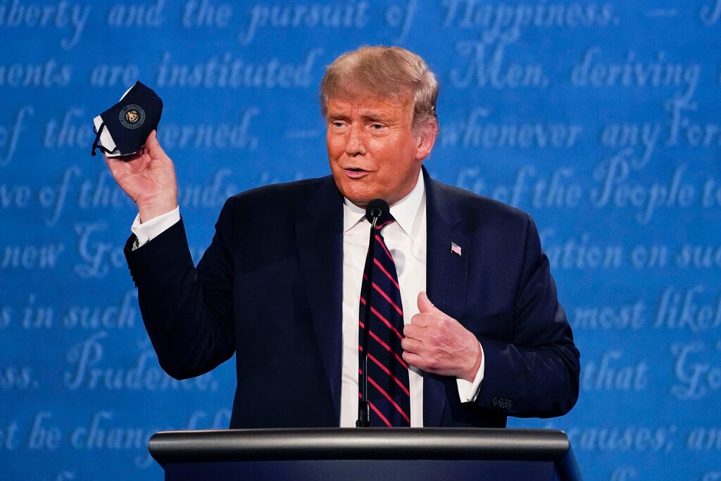 (Julio Cortez | AP photo)

In this Sept. 29, 2020, photo, President Donald Trump holds up his face mask during the first presidential debate at Case Western University and Cleveland Clinic, in Cleveland, Ohio.