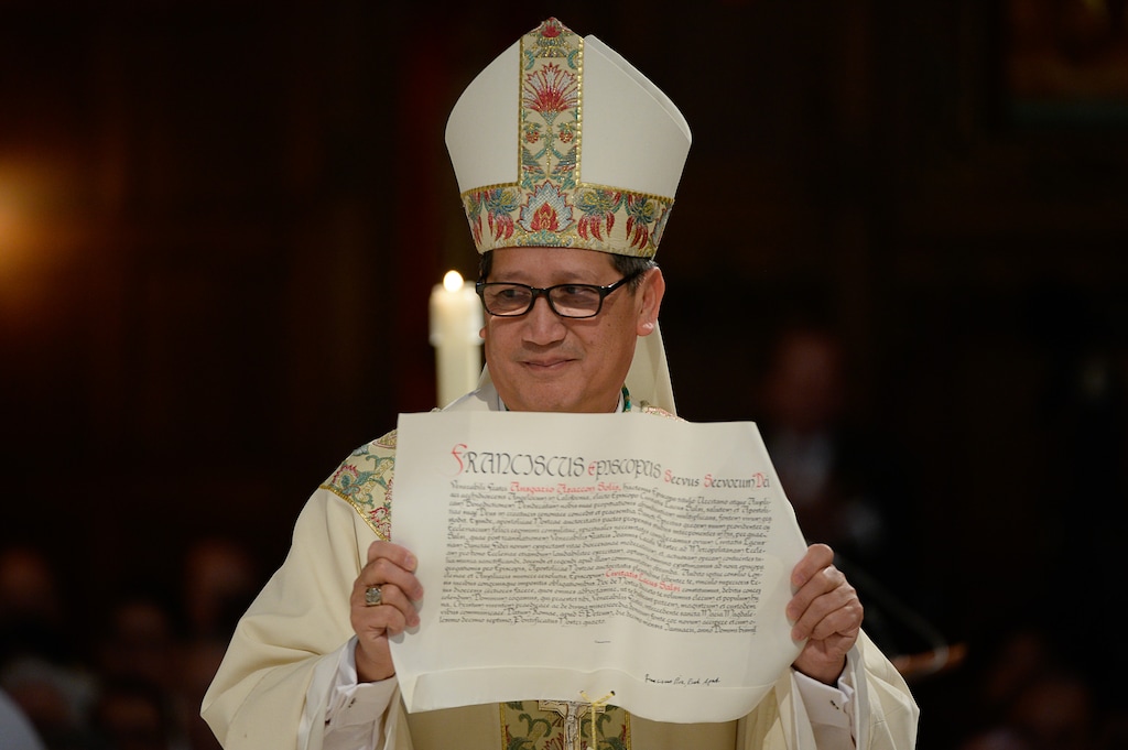 Francisco Kjolseth | The Salt Lake TribuneBishop Oscar A. Solis presents the Apostolic Letter from Pope Francis that officially appoints him as the 10th bishop of the Diocese of Salt Lake City.