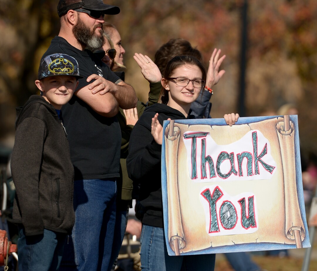 (Leah Hogsten  |  The Salt Lake Tribune)  Cashlin Glover had a big "Thank You" for veterans participating and watching Northern Utah’s 12th Annual Veterans Day Parade Saturday, Nov. 11, 2017 in Layton.