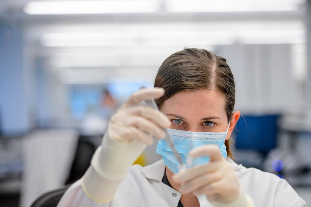 (Trent Nelson | Tribune file photo) Hannah Bennett, a forensic scientist working in the biology section of the Department of Safety Forensic Services lab, processes evidence from a sexual assault collection kit in Taylorsville on May 7, 2019.
