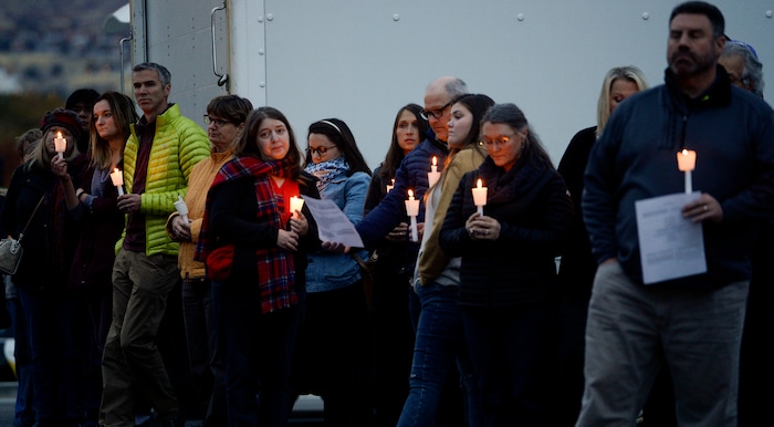 Leah Hogsten | The Salt Lake Tribune Candles are lit outside Chabad Lubavitch of Utah as members of Utah's Jewish and interfaith communities held a vigil and prayer service, Monday, Oct. 29, 2018 for the 11 people killed at the Tree of Life Synagogue in Pittsburgh, Monday, Oct. 29, 2018, "for peace, harmony and love to once again reign supreme upon this Earth."