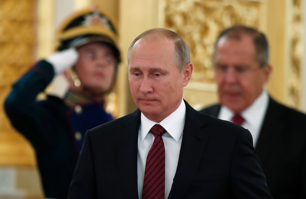 Russian President Vladimir Putin arrives for a ceremony of presentation of credentials in the Kremlin in Moscow, Russia, on Tuesday, Oct. 3, 2017. (AP Photo/Pavel Golovkin, pool)