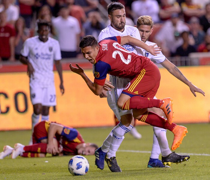 Leah Hogsten | The Salt Lake Tribune San Jose Earthquakes defender Yeferson Quintana (30) takes down Real Salt Lake midfielder Luis Silva (20) as Real Salt Lake hosts the San Jose Earthquakes at Rio Tinto Stadium in Sandy, Utah, Saturday, June 23, 2018.
