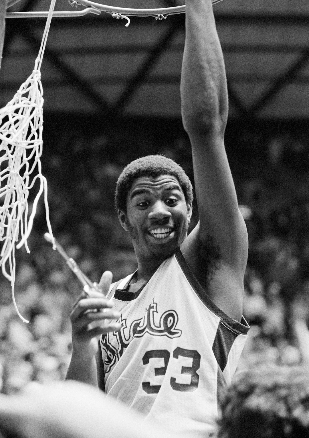 (AP Photo) Earvin "Magic" Johnson of Michigan State participates in victory ceremonies as the net comes down after they defeated Indiana State 75-64 to win the NCAA champion Monday, March 26, 1979 in Salt Lake City. Johnson was named the tournament's most valuable player. 