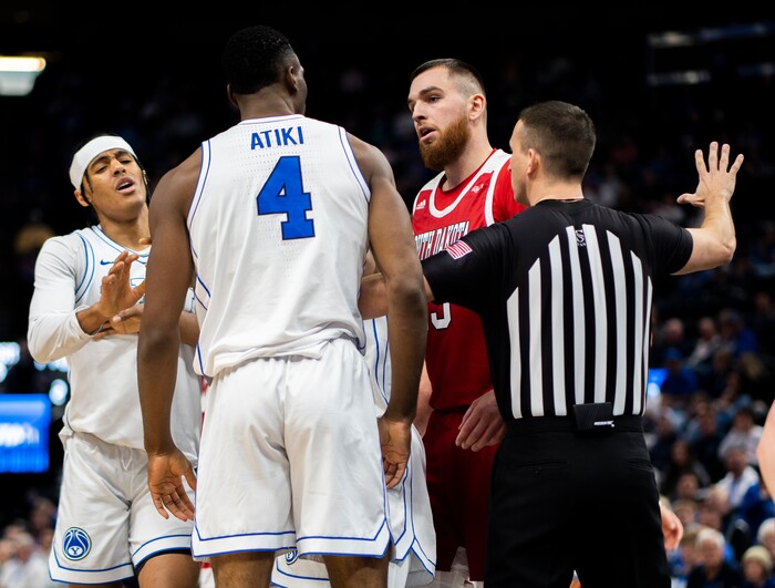 (Rick Egan | The Salt Lake Tribune)  South Dakota Coyotes forward Mihai Carcoana (13) has a few words with Brigham Young Cougars forward Atiki Ally Atiki (4), in basketball action between the Brigham Young Cougars and the South Dakota Coyotes, at Vivint Arena, in Salt Lake City, on Saturday, Dec. 3, 2022.

