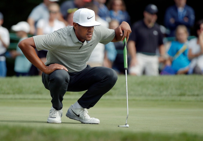 Tony Finau lines up a putt on the seventh hole during the second round of the Deutsche Bank Championship golf tournament Saturday, Sept. 3, 2016, in Norton, Mass. (AP Photo/Michael Dwyer)
