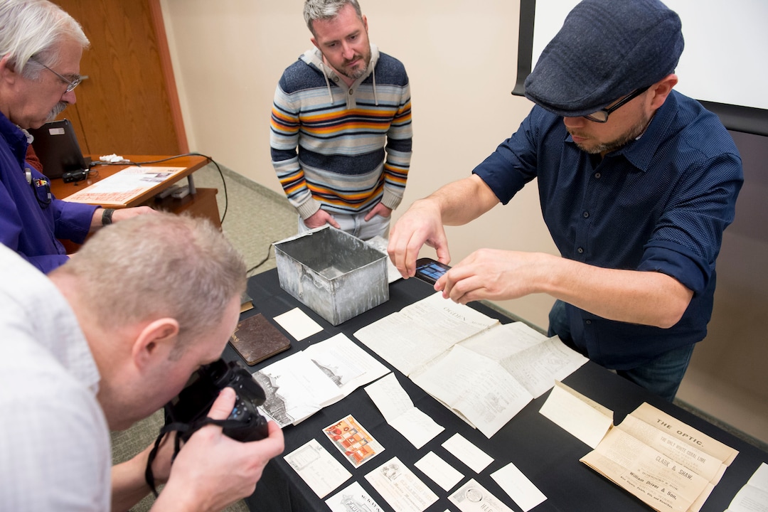 (Jeremy Harmon  |  The Salt Lake Tribune) People view items from a time capsule that was buried in the corner stone of Ogden Academy on September 27, 1887. Items from the time capsule were displayed at the Utah State Archives on Wednesday, Oct. 16, 2019.
