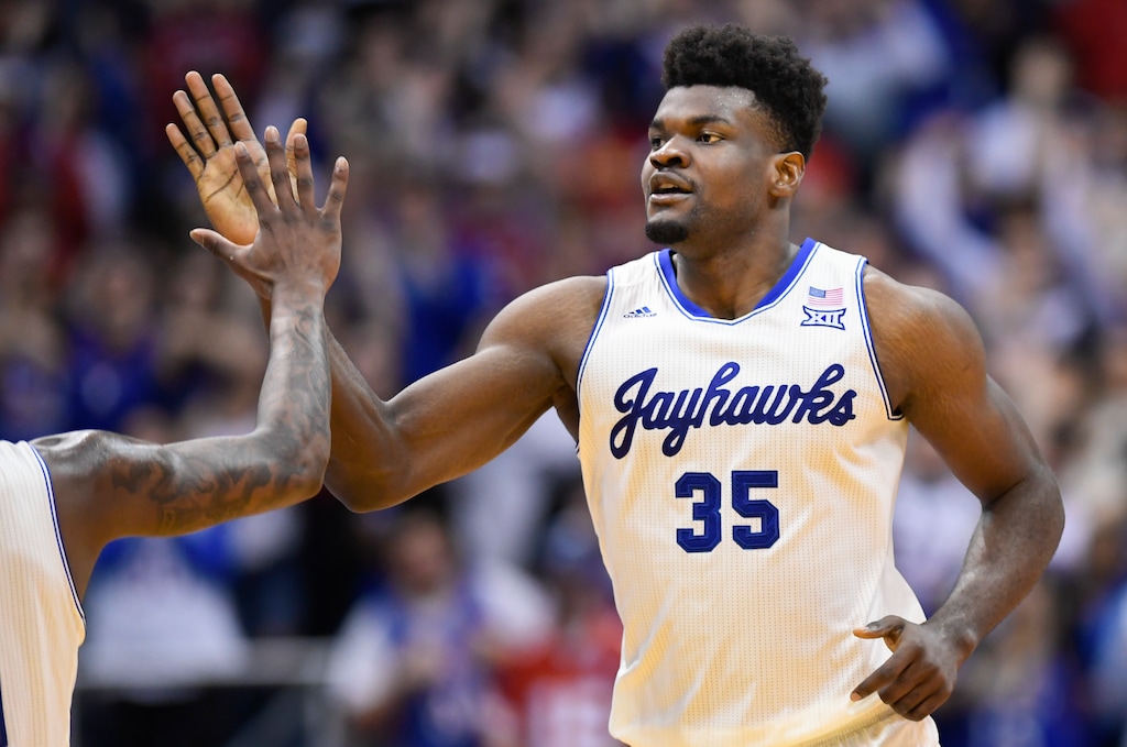 FILE - In this Feb. 3, 2020, file photo, Kansas center Udoka Azubuike (35) is congratulated after a dunk against Texas during the second half of an NCAA college basketball game in Lawrence, Kan. Azubuike was selected by the Utah Jazz in the NBA draft Wednesday, Nov. 18, 2020. (AP Photo/Reed Hoffmann, File)