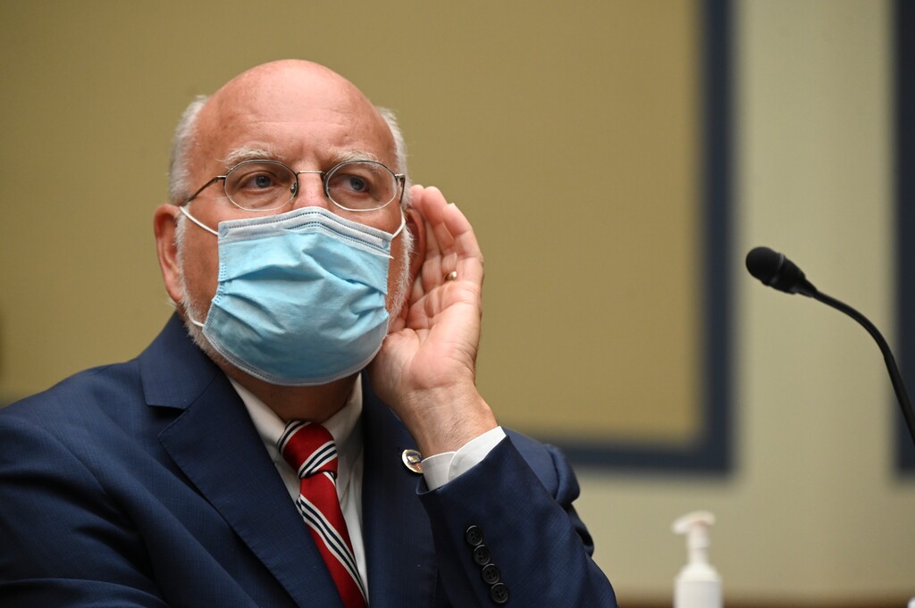 Robert Redfield, director of the Centers for Disease Control and Prevention (CDC), testifies before a House Select Subcommittee hearing on the Coronavirus, Friday, July 31, 2020 on Capitol Hill in Washington.  (Erin Scott/Pool via AP)