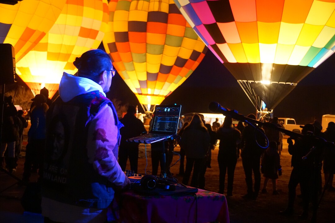 (Zak Podmore | The Salt Lake Tribune) Krieg Benally of Neon Nativez DJs at the Bluff International Balloon Festival on Saturday, Jan. 18, 2020.