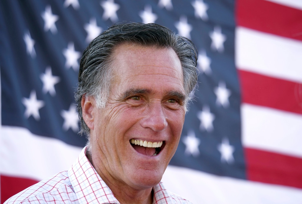 (AP Photo/Rick Bowmer, File) In this June 20, 2018, file photo, Mitt Romney smiles during a campaign event in American Fork, Utah. Romney is calling for a high-tech early detection system and more logging to prevent wildfires ravaging the U.S. West. The U.S. Senate candidate in Utah said in an essay Tuesday, Aug. 7, 2018, the government can do more to prevent fires there and other places like California, which is fighting its largest wildfire in state history.
