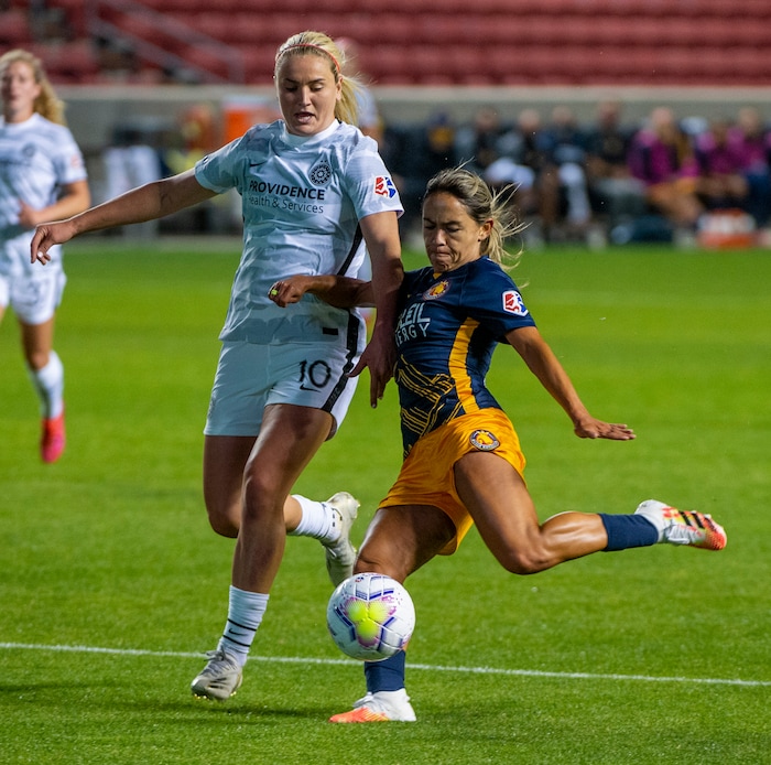(Rick Egan | The Salt Lake Tribune) Utah Royals FC midfielder Lo'eau LaBonta (9) kicks the ball as Portland Thorns FC midfielder Lindsey Horan (10) defends, in soccer action between Utah Royals FC and Portland Thorns FC at Rio Tinto Stadium, on Saturday, Oct. 3, 2020.