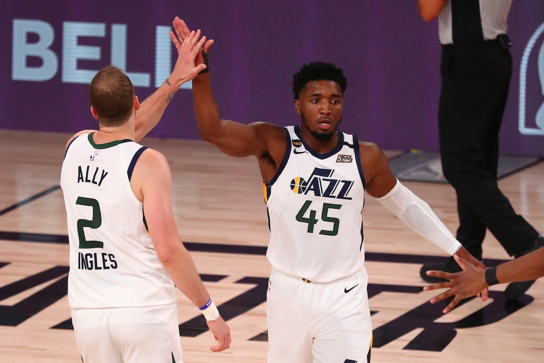 (Kim Klement | Pool via AP) Utah Jazz guard Joe Ingles, left, and guard Donovan Mitchell, right, celebrates against the Denver Nuggets in Game 2 of an NBA basketball first-round playoff series, Wednesday, Aug. 19, 2020, in Lake Buena Vista, Fla.