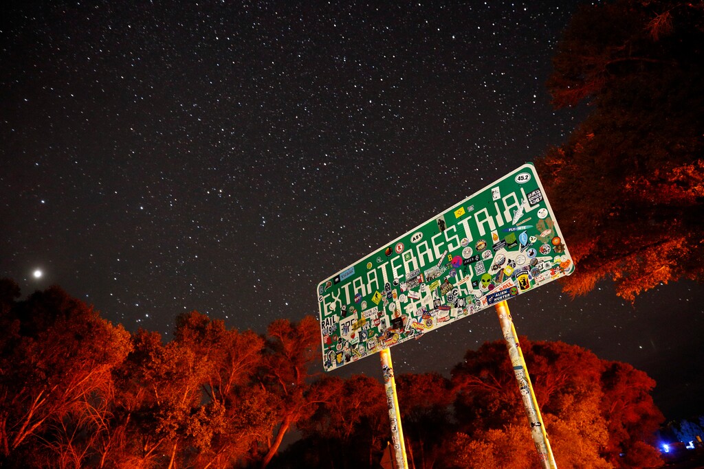 (John Locher | AP file photo) A sign advertises state route 375 as the Extraterrestrial Highway, in Crystal Springs, Nev., on the way to Nevada Test and Training Range near Area 51 on July 22, 2019. Officials in Nevada's rural Lincoln County have drafted an emergency declaration and are planning with state officials to handle possible crowds that might arrive for an event next month dubbed "Storm Area 51." The county commission on Monday, Aug. 19, 2019 conditionally approved two events in tiny desert towns near the site popularly known as the home of government studies of outer space aliens.