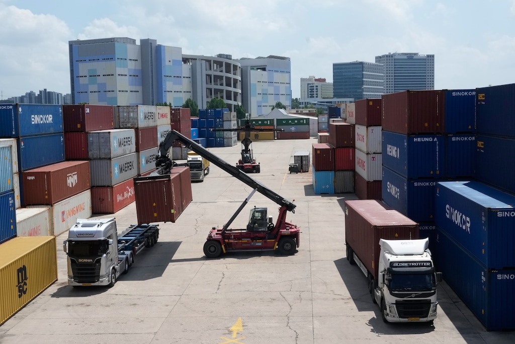 A crane unloads a container from a truck at an Inland Container Depot (ICD) terminal in Uiwang, South Korea, Friday, July 24, 2026. (AP Photo/Ahn Young-joon)