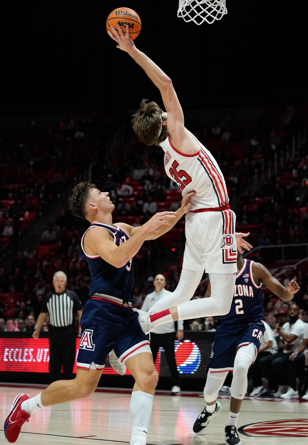 (Francisco Kjolseth | The Salt Lake Tribune) Utah Utes center Branden Carlson (35) stretches back for a shot on basket as the University of Utah hosts the Arizona Wildcats in NCAA basketball in Salt Lake City on Thursday, Dec. 1, 2022.