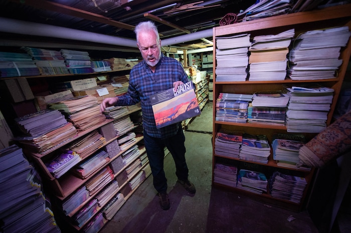 (Francisco Kjolseth  |  The Salt Lake Tribune) John deJong, associate publisher of Catalyst magazine, overlooks the archives in the basement, including one of his covers, at the Salt Lake City-based magazine for wellness and other New Age topics in Salt Lake City.