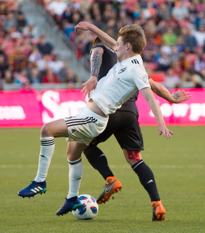 (Rick Egan  |  The Salt Lake Tribune)    Real Salt Lake midfielder Albert Rusnak (11) gets tangled up with Colorado Rapids midfielder Johan Blomberg (8), in MLS soccer action, RSL vs Colorado Rapids at Rio Tinto Stadium, Saturday, April 21, 2018.


