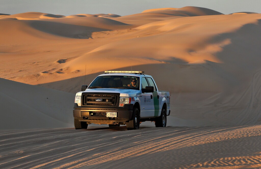 (Matt York | The Associated Press) A U.S. Customs and Border Patrol agent patrols a area of sand dunes Wednesday, July 18, 2018 along the international border with Mexico in Imperial County, Calif. 126-miles of border cuts through the Yuma Sector where thousands of families and unaccompanied children are continuing to cross into Arizona and California even after learning of the government's family separation policy upon apprehension.
