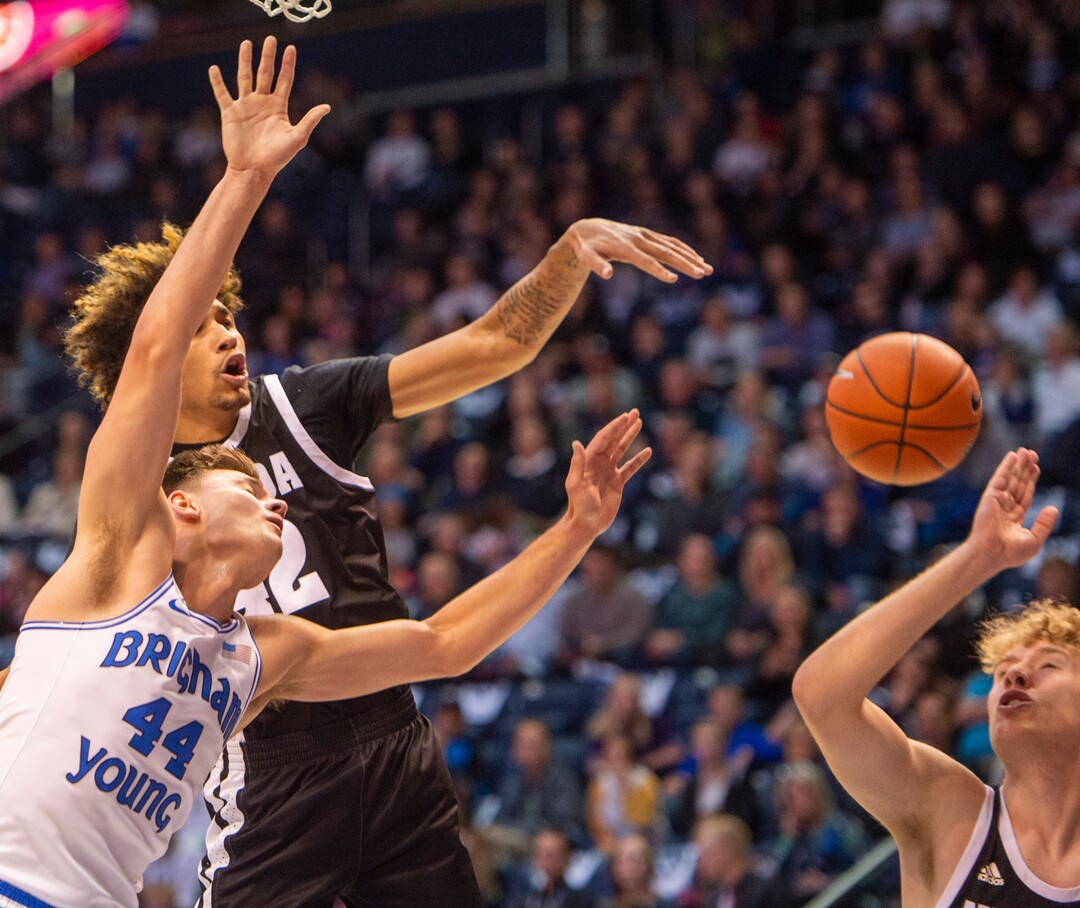 (Rick Egan  |  The Salt Lake Tribune)        Nevada Wolf Pack forward K.J. Hymes (42) blacks a shot by Brigham Young Cougars guard Connor Harding (44), in basketball action between the Brigham Young Cougars and the Nevada Wolf Pack, at the Marriott Center, in Provo, Saturday, December 10, 2019.