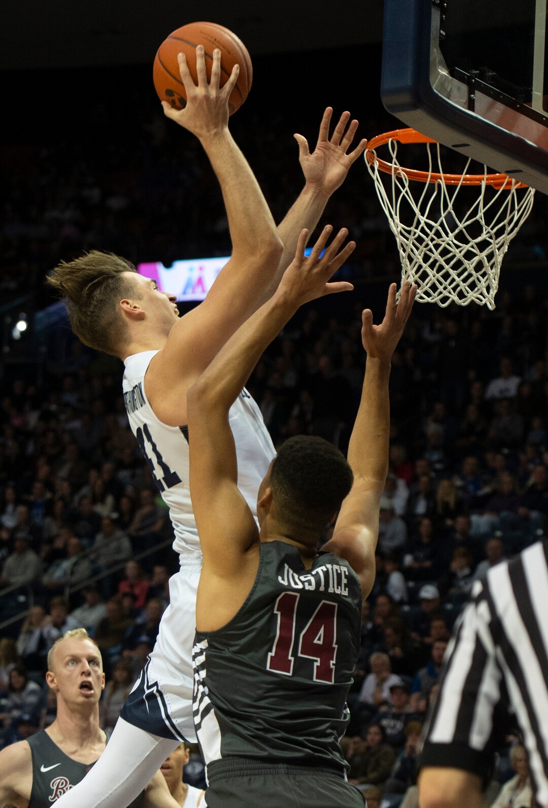 (Rick Egan  |  The Salt Lake Tribune)       Brigham Young Cougars forward Luke Worthington (41) scores over Santa Clara Broncos forward Keshawn Justice (14), in basketball action between Brigham Young Cougars and Santa Clara Broncos at the Marriott Center in Provo, Saturday, Jan. 12, 2019.