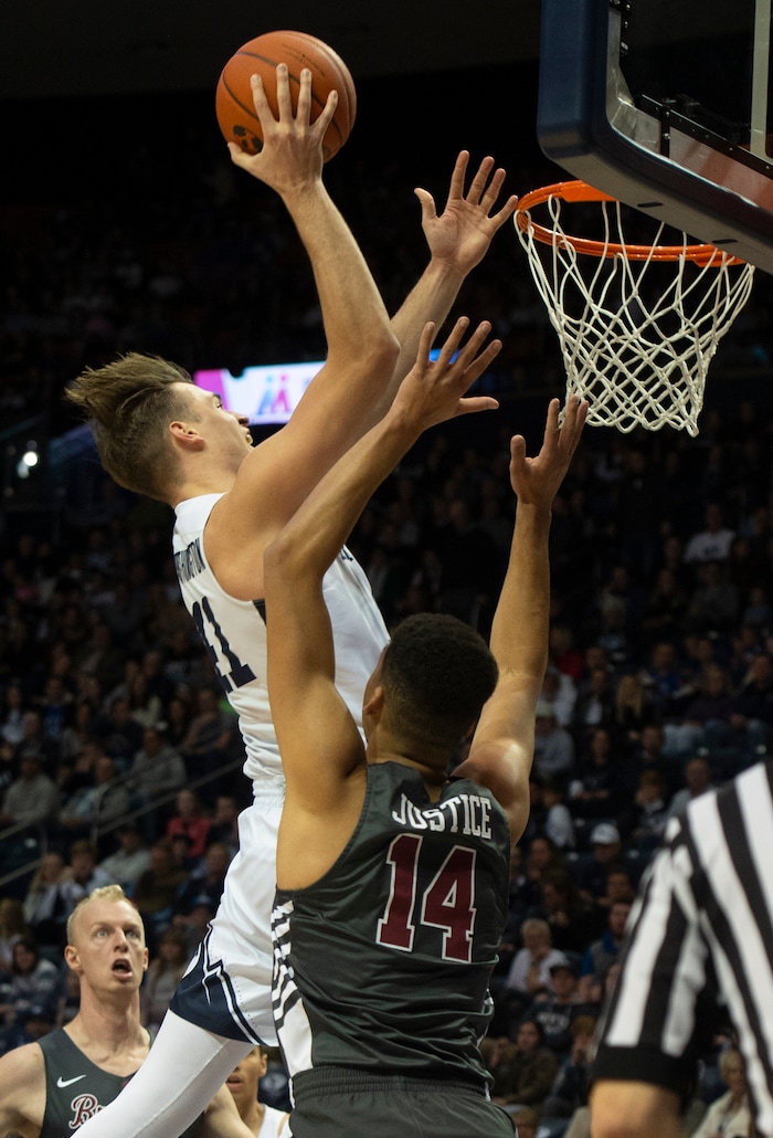 (Rick Egan  |  The Salt Lake Tribune)       Brigham Young Cougars forward Luke Worthington (41) scores over Santa Clara Broncos forward Keshawn Justice (14), in basketball action between Brigham Young Cougars and Santa Clara Broncos at the Marriott Center in Provo, Saturday, Jan. 12, 2019.



