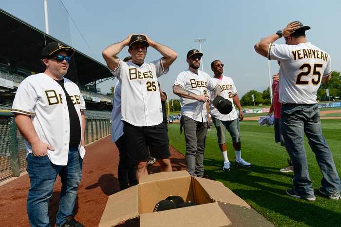 (Francisco Kjolseth  |  The Salt Lake Tribune)  The Salt Lake Bees celebrate the 25th anniversary of the Utah-filmed "The Sandlot" with members of the original cast at the Smith's Ballpark on Friday, Aug. 10, 2018. Sporting jerseys with their character names, Tommy (Shane Obedzinski), Phillips (Wil Horneff), Bertram (Grant Gelt), DeNunez (Brandon Quintin Adam) and Yeah-Yeah (Marty York), from left, get outfitted with ball caps as they gather on the field during the Bees warm up. 