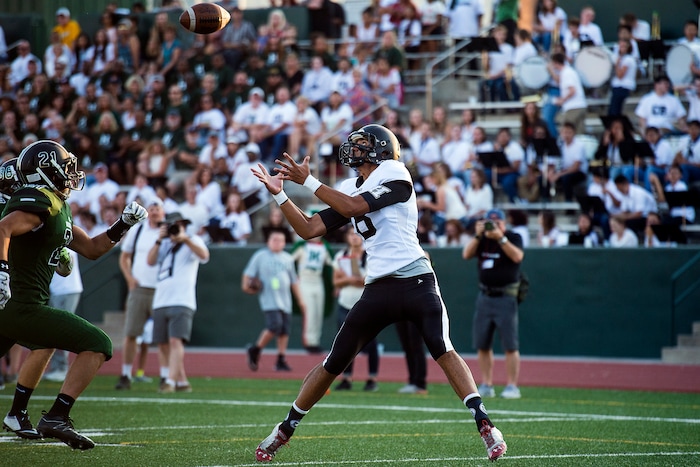 (Chris Detrick  |  The Salt Lake Tribune)    Highland's Richard Tialavea (8) makes a touchdown catch past Hillcrest's Bassel Tekarli (21) during the game at Hillcrest High School Friday, September 1, 2017. 