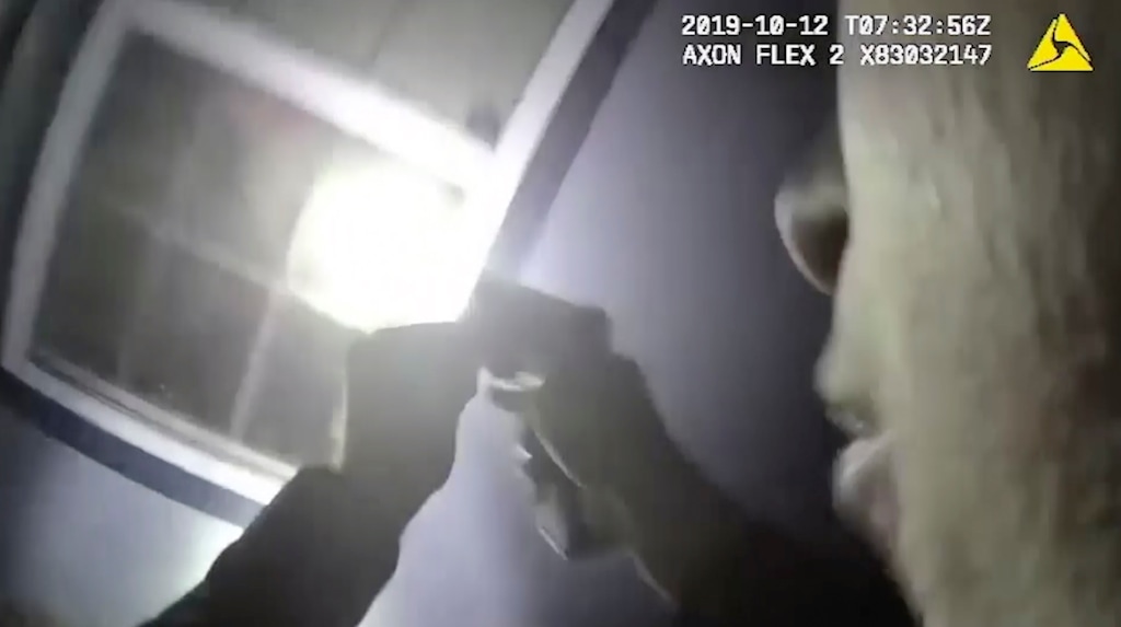 (Fort Worth Police Department | AP) In this Saturday, Oct. 12, 2019, image made from a body camera video released by the Fort Worth Police Department an officer shines a flashlight into a window in Fort Worth, Texas. A black woman was fatally shot by a white Fort Worth, Texas, officer inside the home early Saturday after police were called to the residence for a welfare check, authorities said. The Tarrant County Medical Examiner's Office identified her as 28-year-old Atatiana Jefferson.