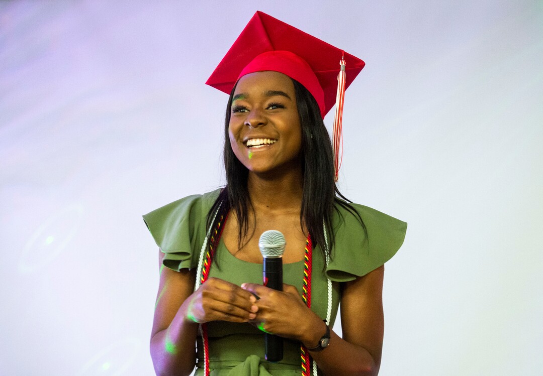 (Rick Egan  |  The Salt Lake Tribune)  Academy of Math, Engineering and Science graduate Sylviane Bahati talks to the crowd during her graduation party.  Saturday May 25, 2019
