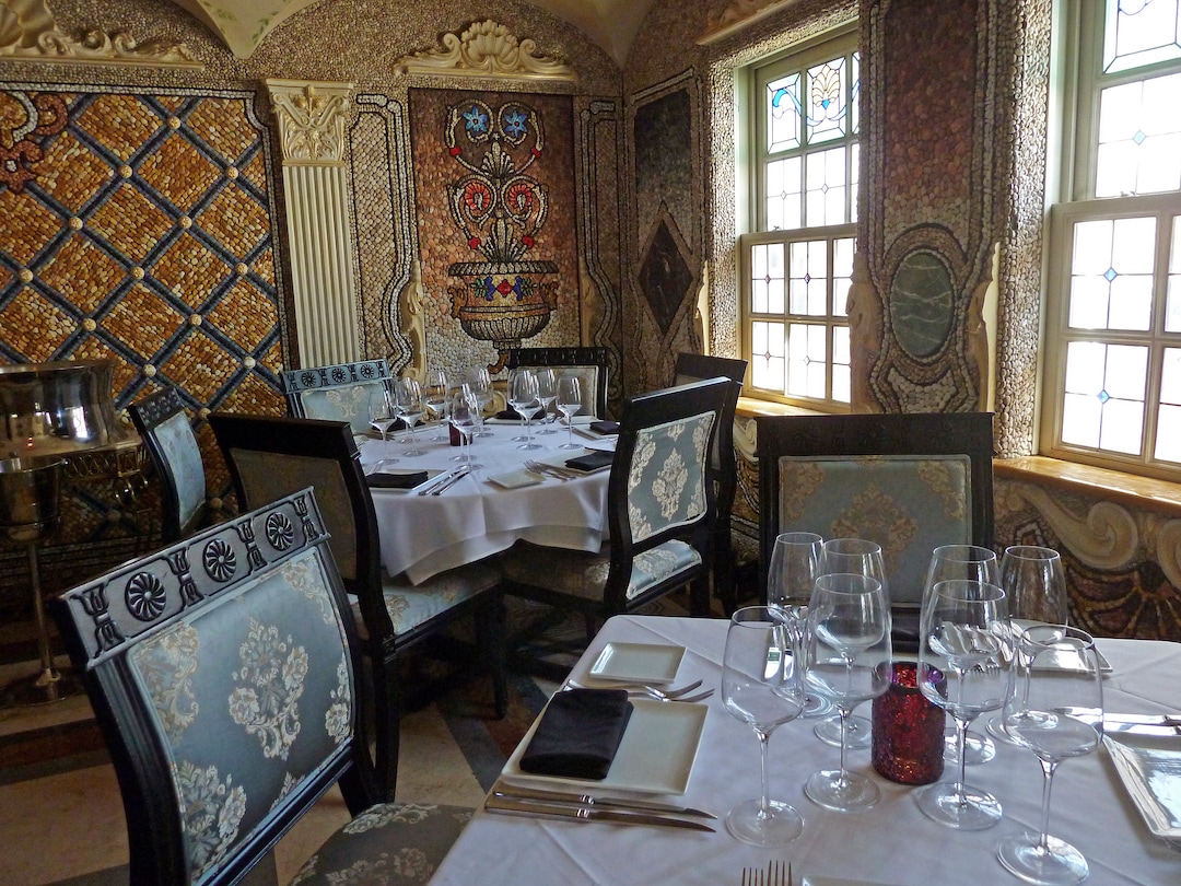 In this Dec. 26, 2017 photo, mosaics that fashion designer Gianni Versace created for his dining room in his South Beach mansion are now the backdrop for the gourmet restaurant inside The Villa Casa Casuarina in Miami Beach, Fla. The property featured in the new season of "American Crime Story" is open to restaurant patrons and hotel guests. (AP Photo/Jennifer Kay)