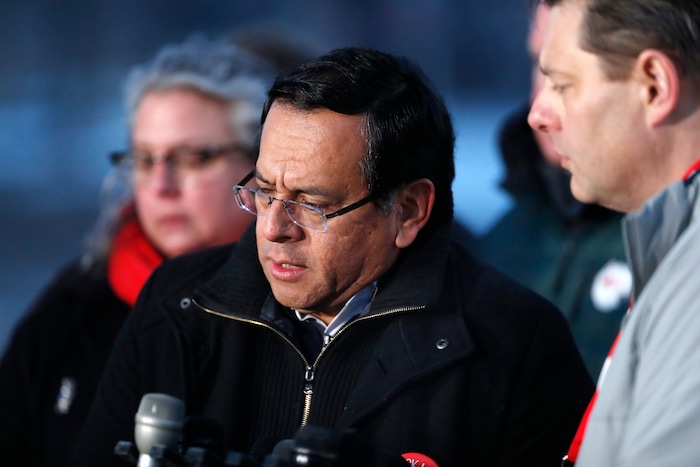 Henry Roman, president of the Denver Classroom Teachers Association, considers a question during a news conference as teachers from his union walk a picket line outside South High School early Monday, Feb. 11, 2019, in Denver. (AP Photo/David Zalubowski)