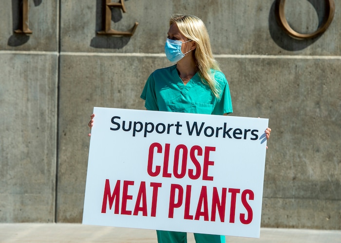 (Rick Egan | The Salt Lake Tribune) Niki Davis, joins a protest at the State Capitol as the Physicians Committee for Responsible Medicine is asking Gov. Herbert to close meatpacking plants in the state to slow the spread of the coronavirus, Thursday, July 30, 2020.