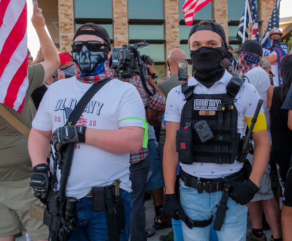 (Leah Hogsten  |  The Salt Lake Tribune) Landon Buttars, right, is seen at the Cottonwood Heights Police Department on August 2, 2020. He has been charged with assault for allegedly pepper-spraying a citizen reporter in the face at a Black Lives Matter protest.