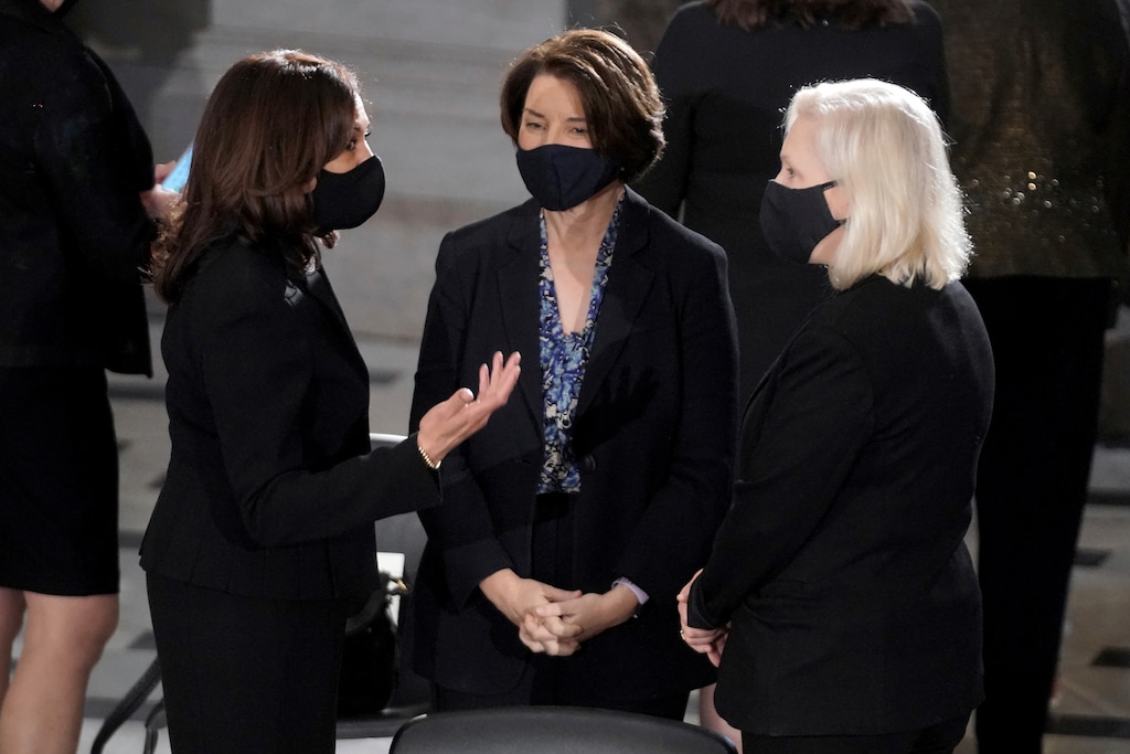 Democratic vice presidential candidate Sen. Kamala Harris, D-Calif., left, talks with Sen. Amy Klobuchar, D-Minn., and Sen. Kirsten Gillibrand, D-N.Y., right, before a ceremony to honor Justice Ruth Bader Ginsburg as she lies in state at National Statuary Hall in the U.S. Capitol on Friday, Sept. 25, 2020. Ginsburg died at the age of 87 on Sept. 18 and is the first women to lie in state at the Capitol. (Greg Nash/Pool via AP)