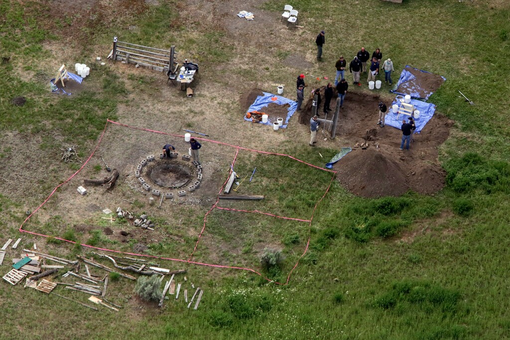 (John Roark | The Idaho Post-Register via AP, file) In this Tuesday, June 9, 2020 aerial photo, investigators search for human remains at Chad Daybell's residence in the 200 block of 1900 east, in Salem, Idaho. Court documents say authorities used cellphone information from the now-deceased uncle of two missing Idaho children to find the youths' bodies on Daybell's rural property. Daybell and the children's mother, Lori Vallow Daybell, are in custody.