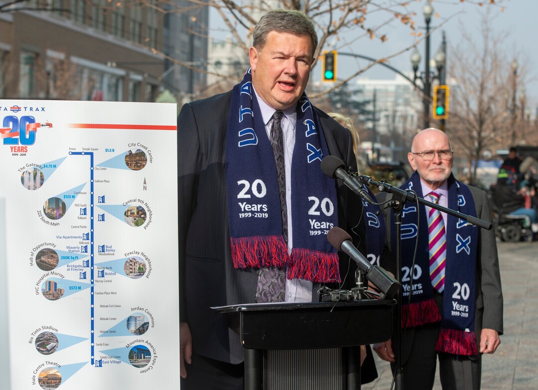 (Rick Egan  |  The Salt Lake Tribune)      Carlton Christensen speaks as officials celebrate the 20th anniversary of TRAX trains during a news conference at the City Creek Trax stop on Main Street in Salt Lake City, Wednesday, Dec. 4, 2019.