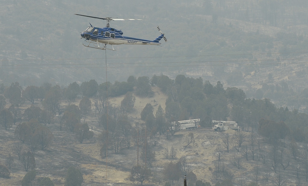(Francisco Kjolseth  |  The Salt Lake Tribune)  Crews continue to battle the Coal Hollow Fire near Highway 6 on Saturday, Aug. 11, 2018.