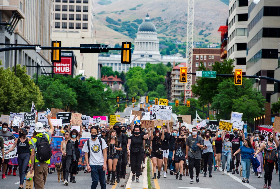 (Rick Egan  |  The Salt Lake Tribune)     Protesters march down State Street in Salt Lake City on Saturday, June 13, 2020.