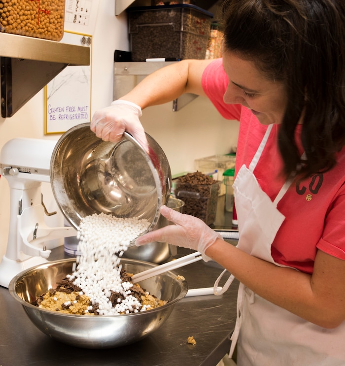 Rick Egan  |  The Salt Lake Tribune
Sarah McNamara, owner of Dough Co., mixes a batch of s'more cookie dough. The new dessert shop in Sugar House sells scoops of edible cookie dough. Monday, July 31, 2017