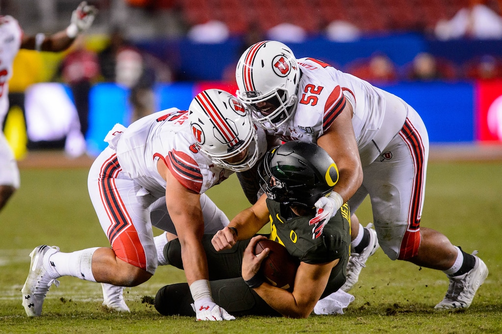 (Trent Nelson  |  The Salt Lake Tribune) Utah defensive end Bradlee Anae (6) and defensive tackle John Penisini (52), shown tackling Oregon quarterback Justin Herbert in a loss in the Pac-12 championship game, hope to leave fans with a better impression as they face Texas in the Alamo Bowl in San Antonio.