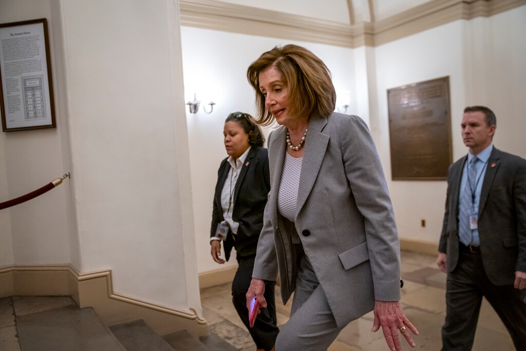 (J. Scott Applewhite | AP) Speaker of the House Nancy Pelosi, D-Calif., arrives at the Capitol in Washington, Friday, Jan. 10, 2020. Pelosi hasn't relayed the articles of impeachment to the Senate for trial three weeks since President Donald Trump was impeached on charges of abuse and obstruction. Last night, she led the Democrat-controlled House in passing a measure limiting Trump's ability to take military action against Iran after he ordered the U.S. killing of a top Iranian general.
