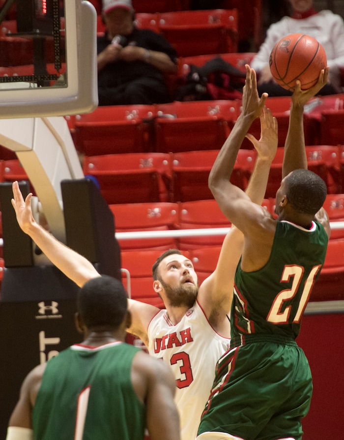 (Rick Egan  |  The Salt Lake Tribune)  Mississippi Valley State Delta Devils forward Arinze Anakwenze (21) shoots over Utah Utes forward Jakub Jokl (43), in basketball action Utah Utes vs. Mississippi Valley State Delta Devils, at the Jon M. Huntsman Center,  Monday, November 13, 2017.