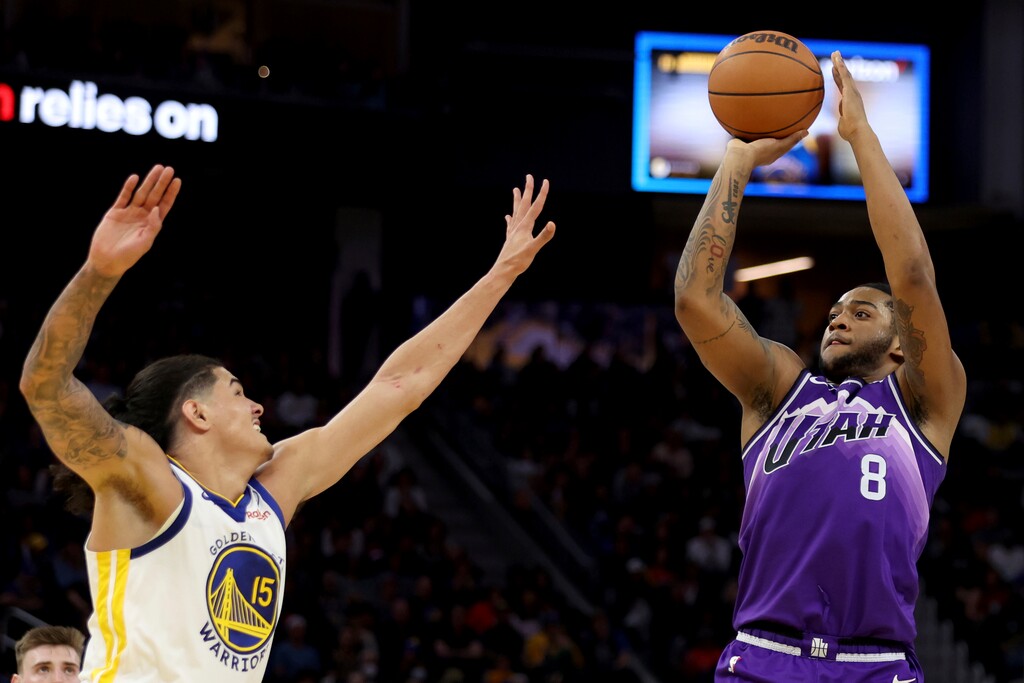 Utah Jazz forward Brice Sensabaugh (8) shoots against Golden State Warriors forward Gui Santos (15) during the second half of an NBA basketball game in San Francisco, Sunday, April 14, 2024. (AP Photo/Jed Jacobsohn)